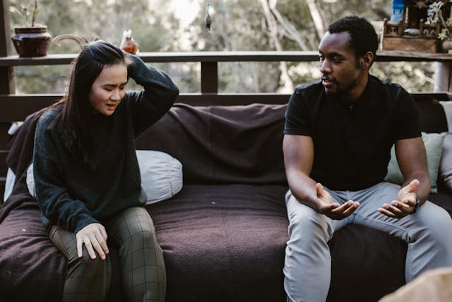 A man talking to a woman