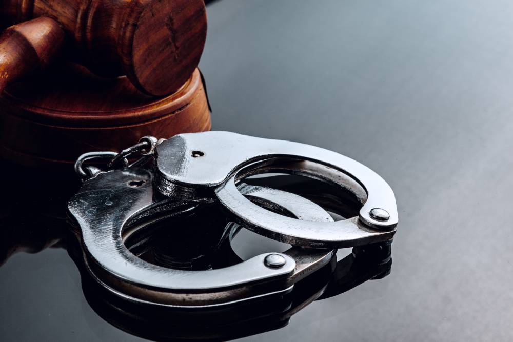 Handcuffs and a judge’s gavel