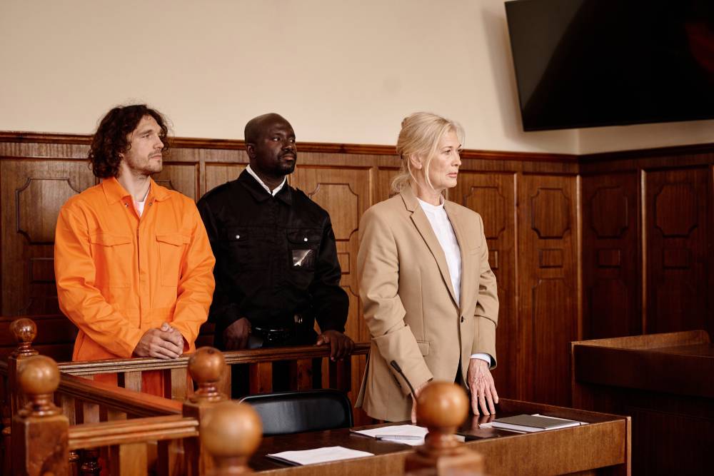 A cop standing between a prisoner and an attorney