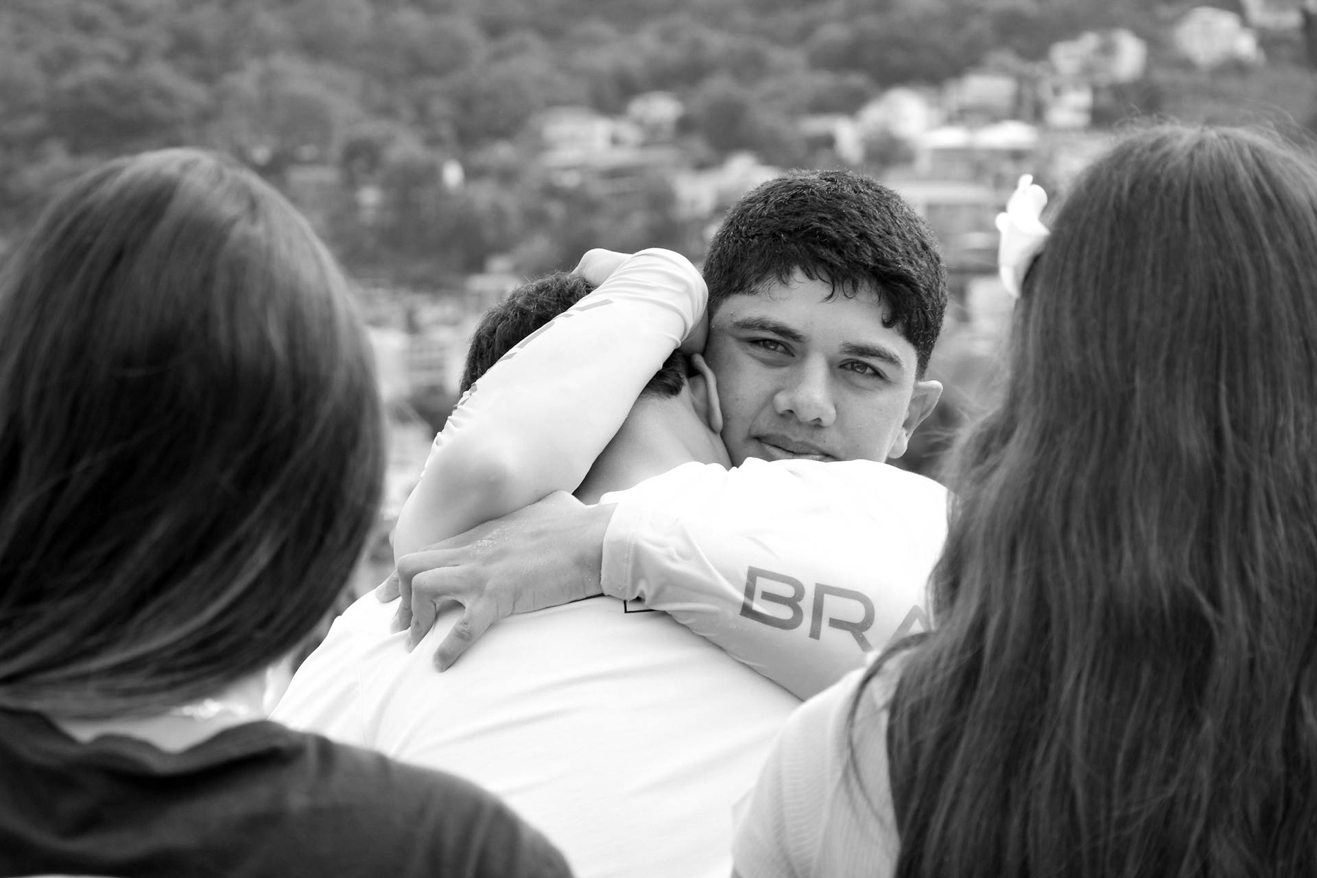 Family members hug following a dispute