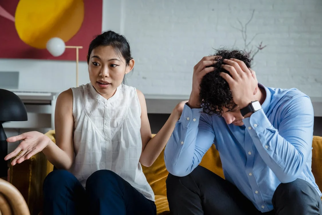 A couple sitting while arguing